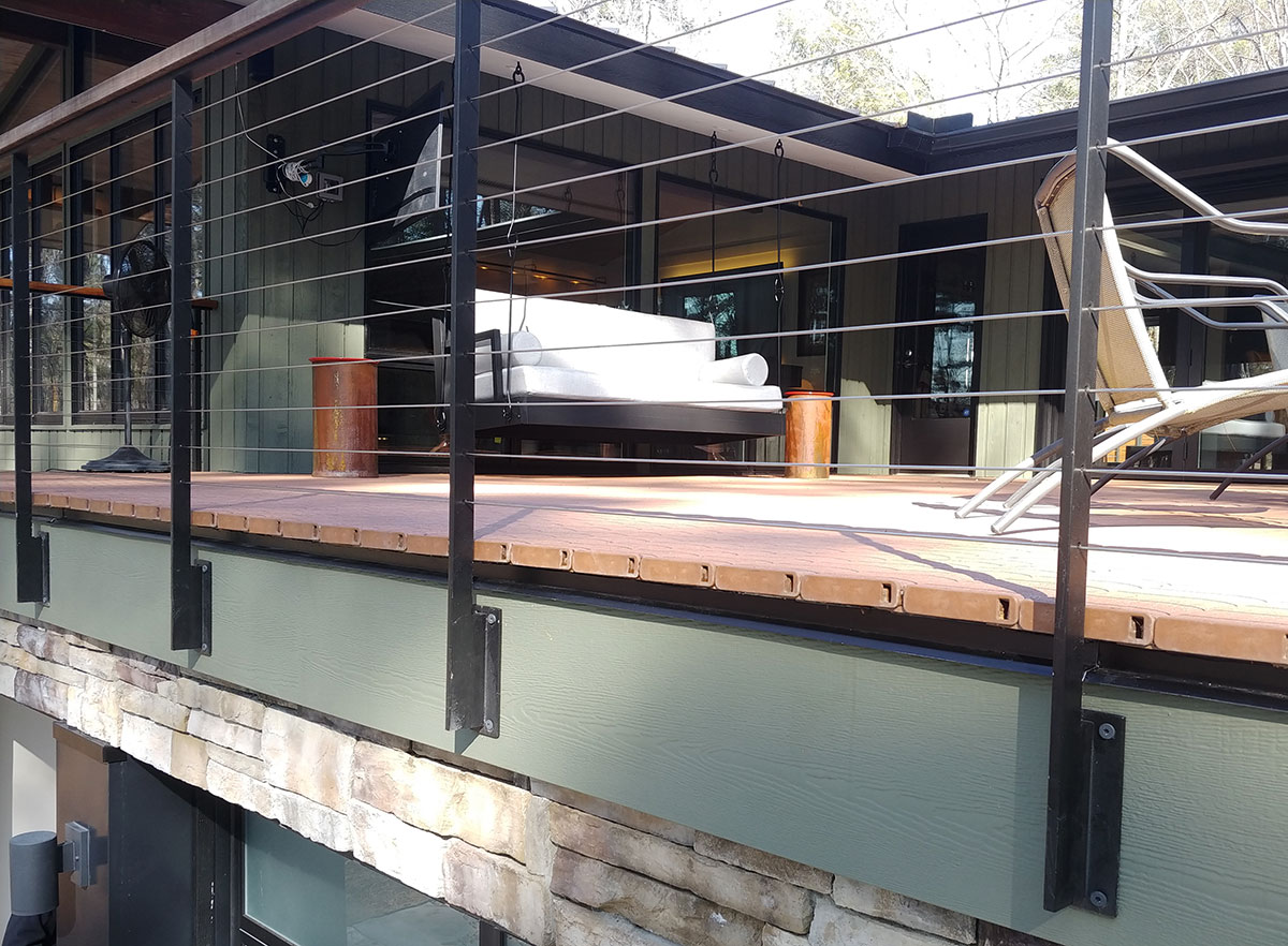 Image of outdoor deck featuring DuxxBak Dekk composite dekcing with superior composition to defy the elements.