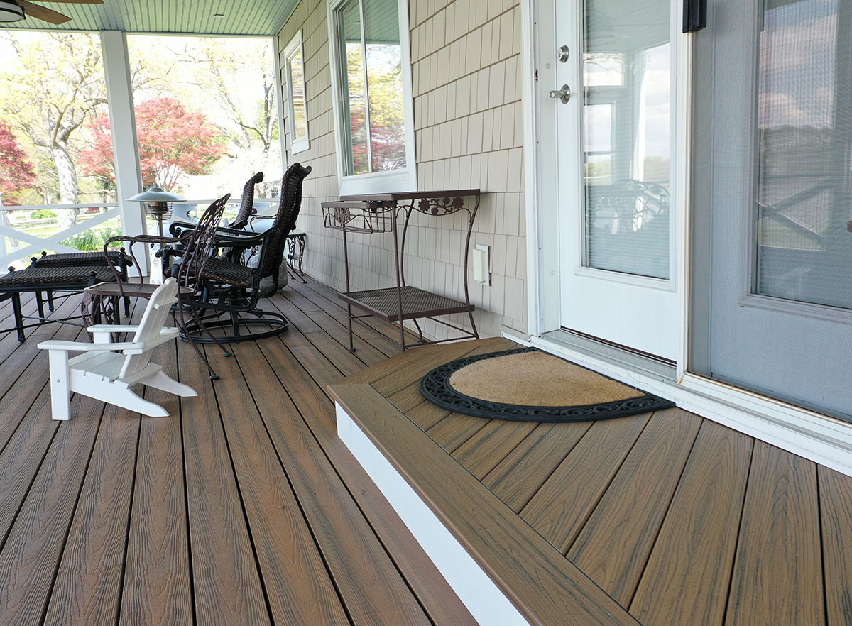 Covered porch and entry to residence showing our Optima Dekk composite decking.