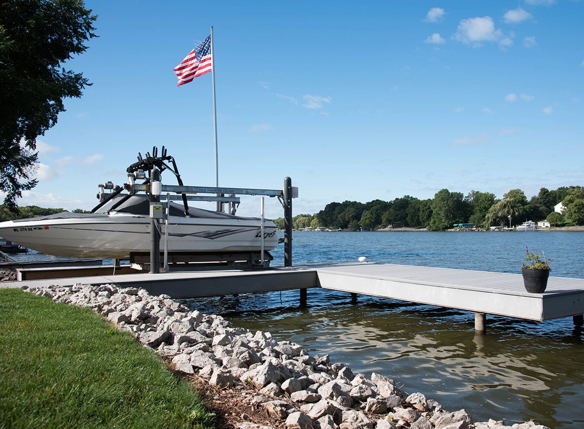 Image of a dock with speedboat showing dock built with I.Dekk HD from Duxxbak Composite Decking.